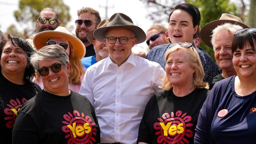 Albanese smiles and poses for a photo with Yes campaigners.