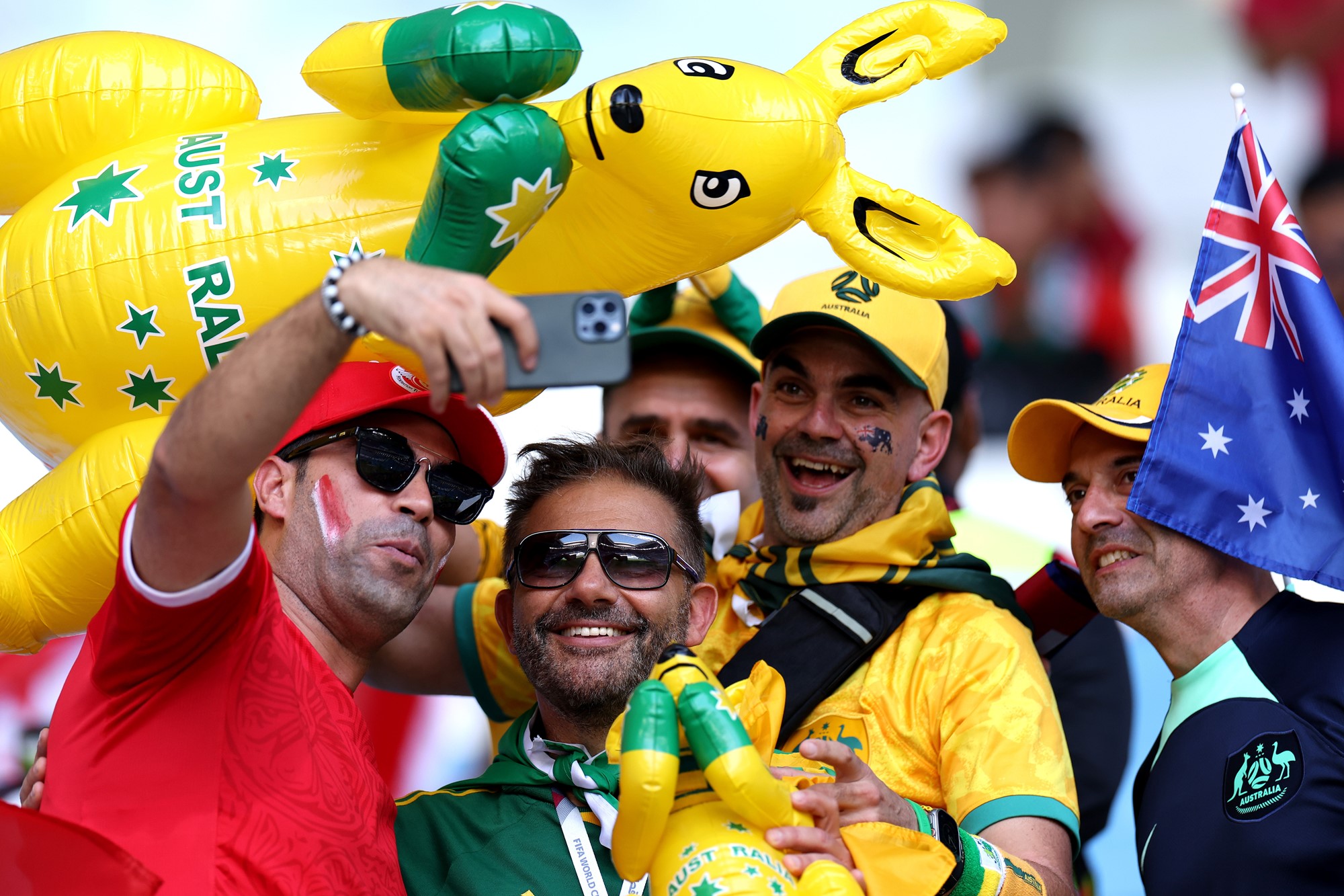 Socceroos fans mingle with Tunisia fans