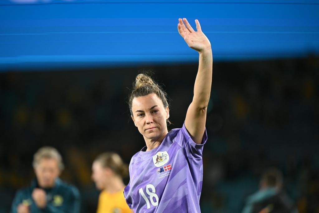 Matildas goalkeeper Mackenzie Arnold waves to fans after Australia beat Denmark at the Women's World Cup.