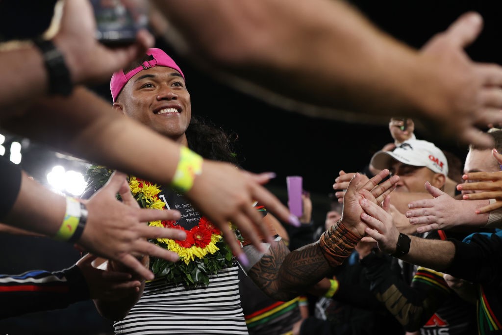 Brian To'o high-fives fans after the Penrith Panthers won the NRL grand final.