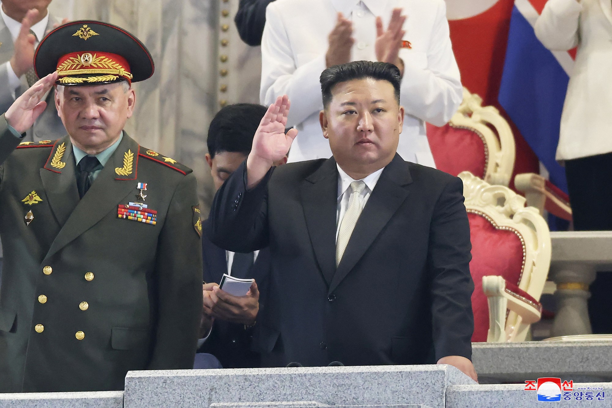 Kim Jong un, a stout korean man in a black suit 