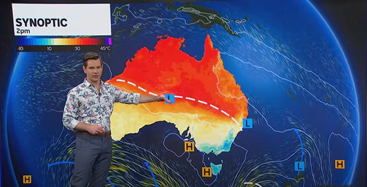 A man standing in front of a Synoptic Chart.