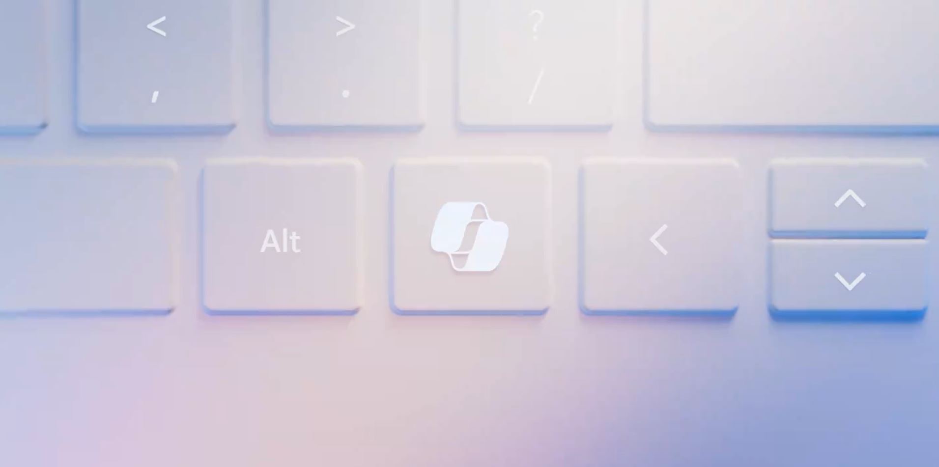 A top-down view of a very light blue-purple keyboard with an overlapping symbol on a key between the "Alt" key and the left arrow key.