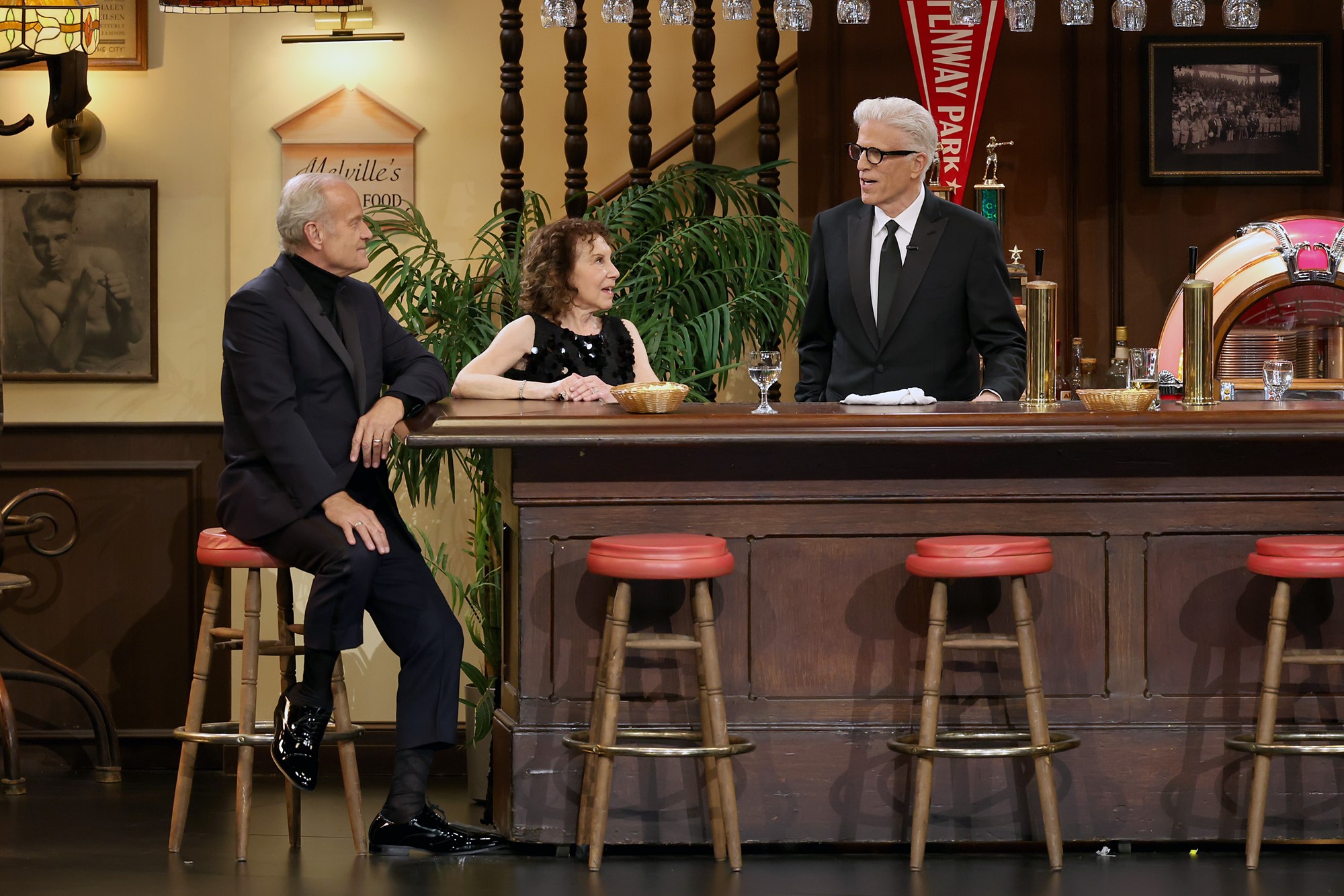 Kelsey Grammer, Rhea Perlman, and Ted Danson sitting around a bar. 