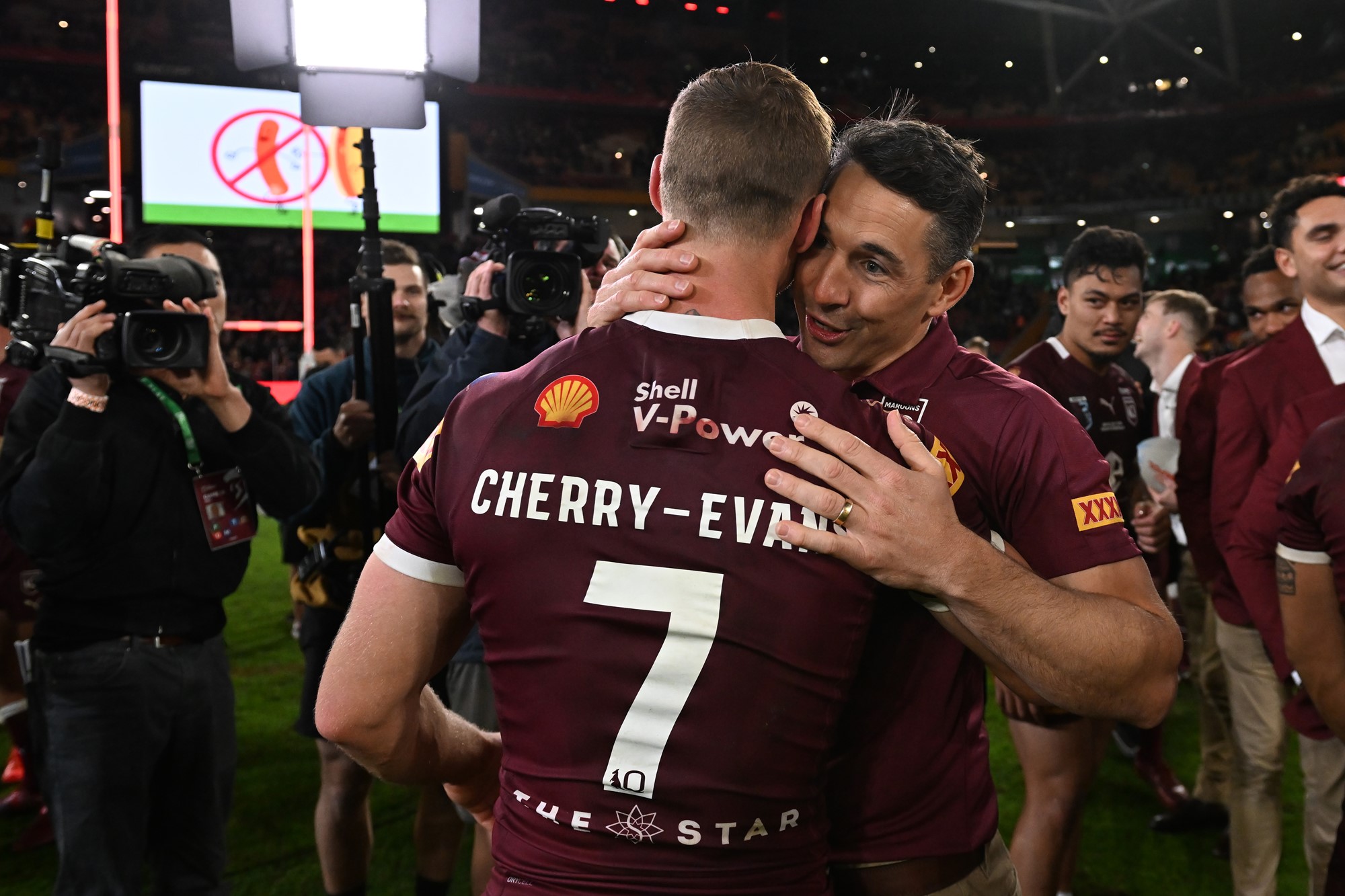 Billy Slater hugs Daly Cherry-Evans after winning State of Origin.