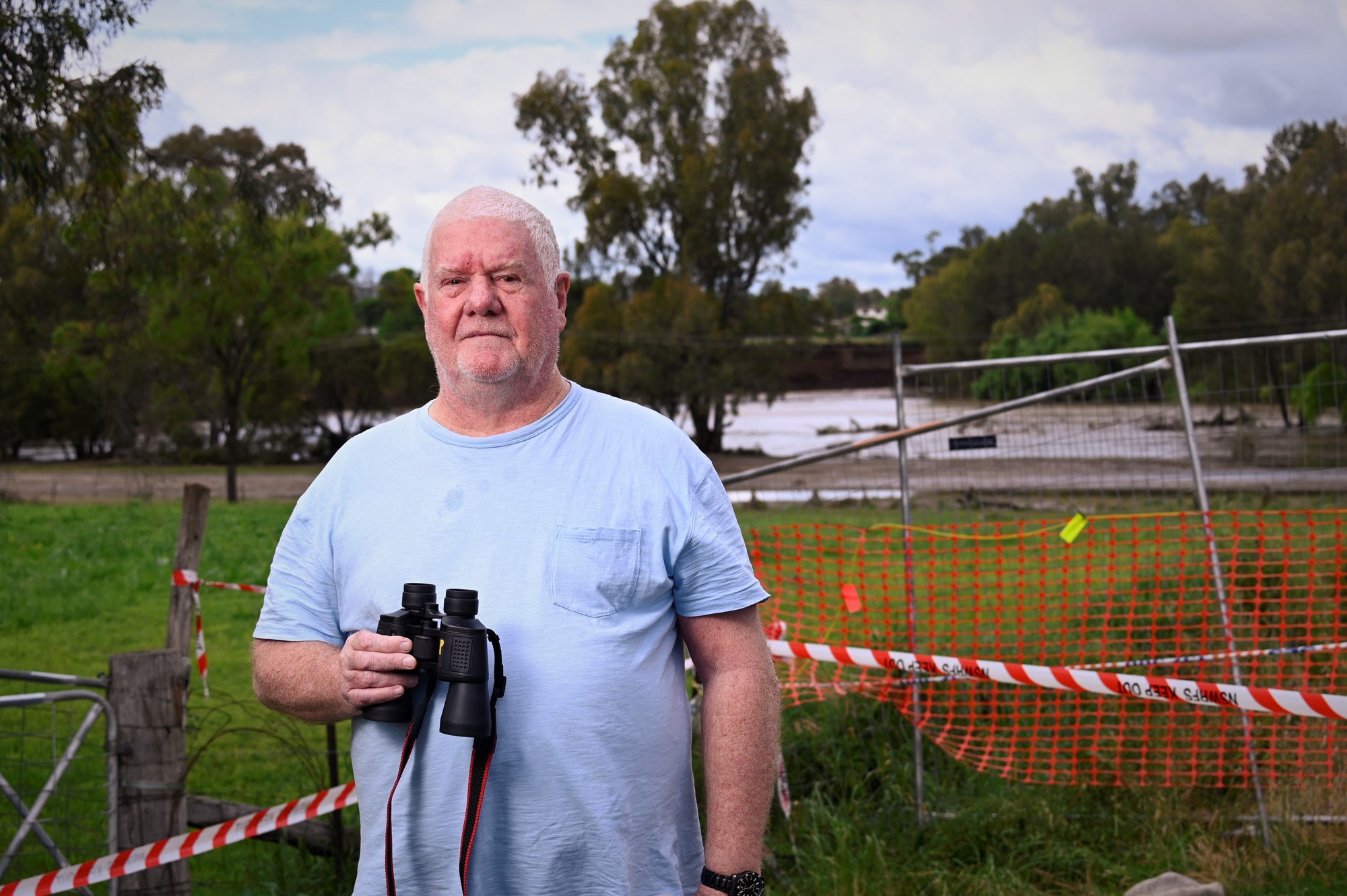 Wellington local Steven Robinson standing with binoculars