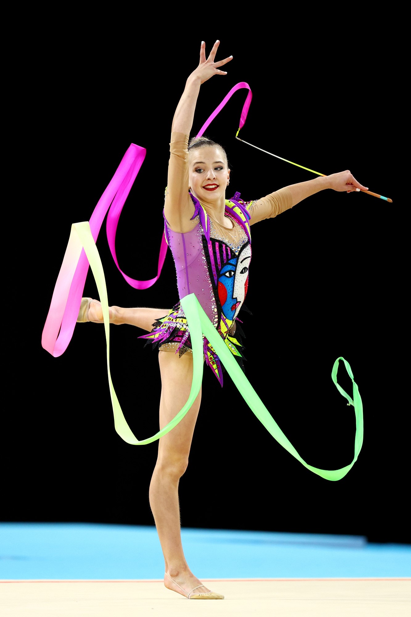 A gymnast performs with a ribbon in the rhythmic gymnastics Commonwealth Games final.