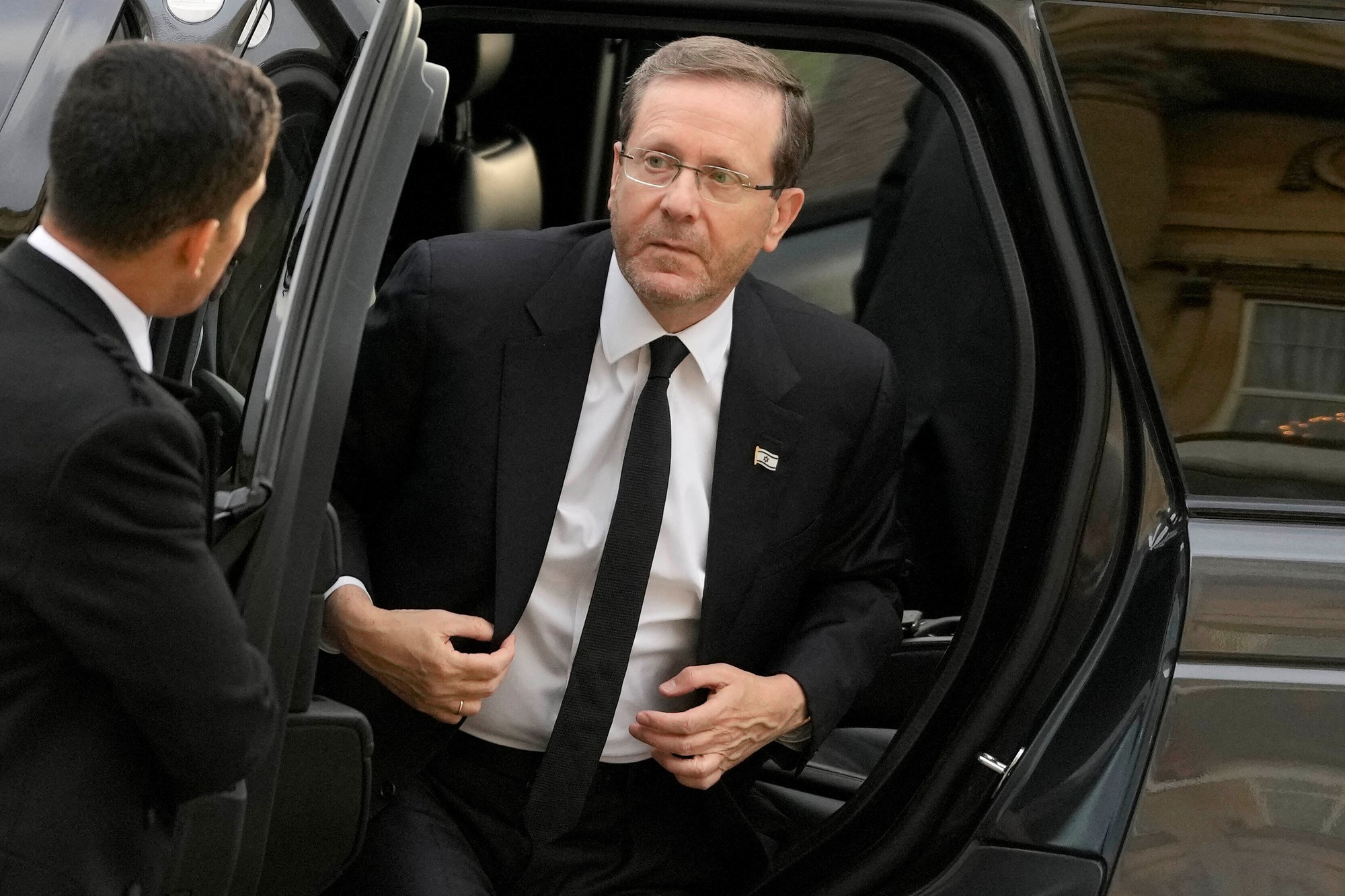 Israel's President Isaac Herzog getting out of a car