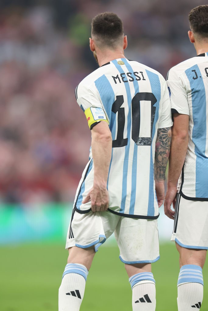 Lionel Messi feels his leg during Argentina's FIFA World Cup semifinal against Croatia in Qatar.