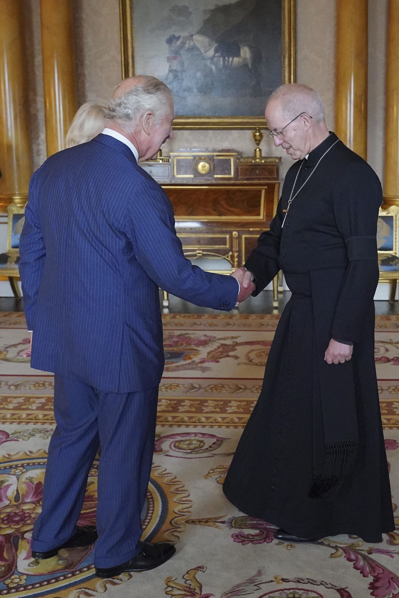King Charles III shakes hands with the Archbishop of Canterbury