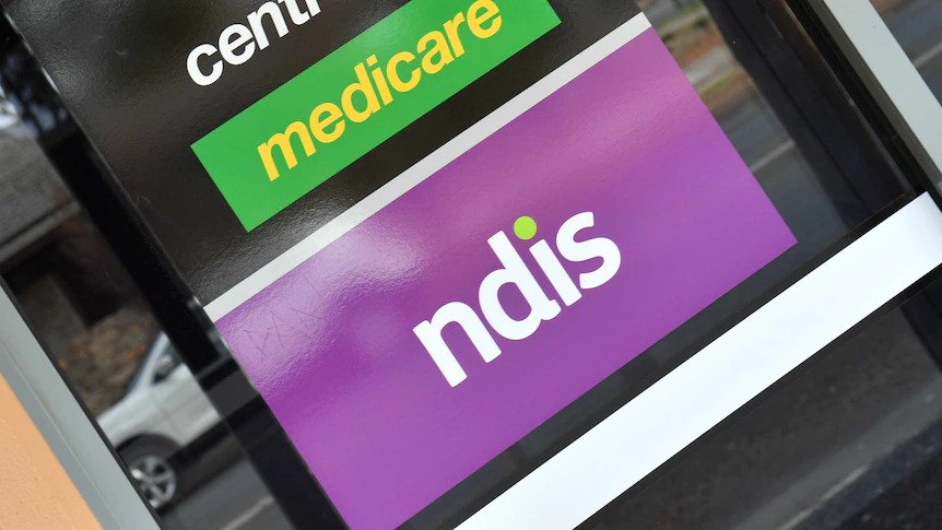 A purple sign for the NDIS.