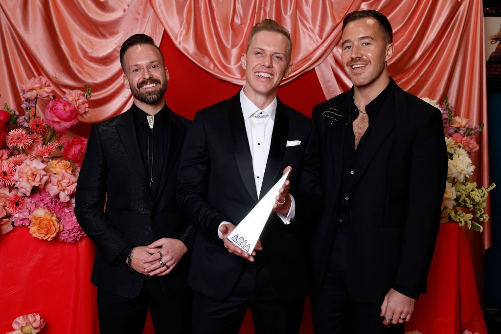 rufus du sol pose with aria award in media room