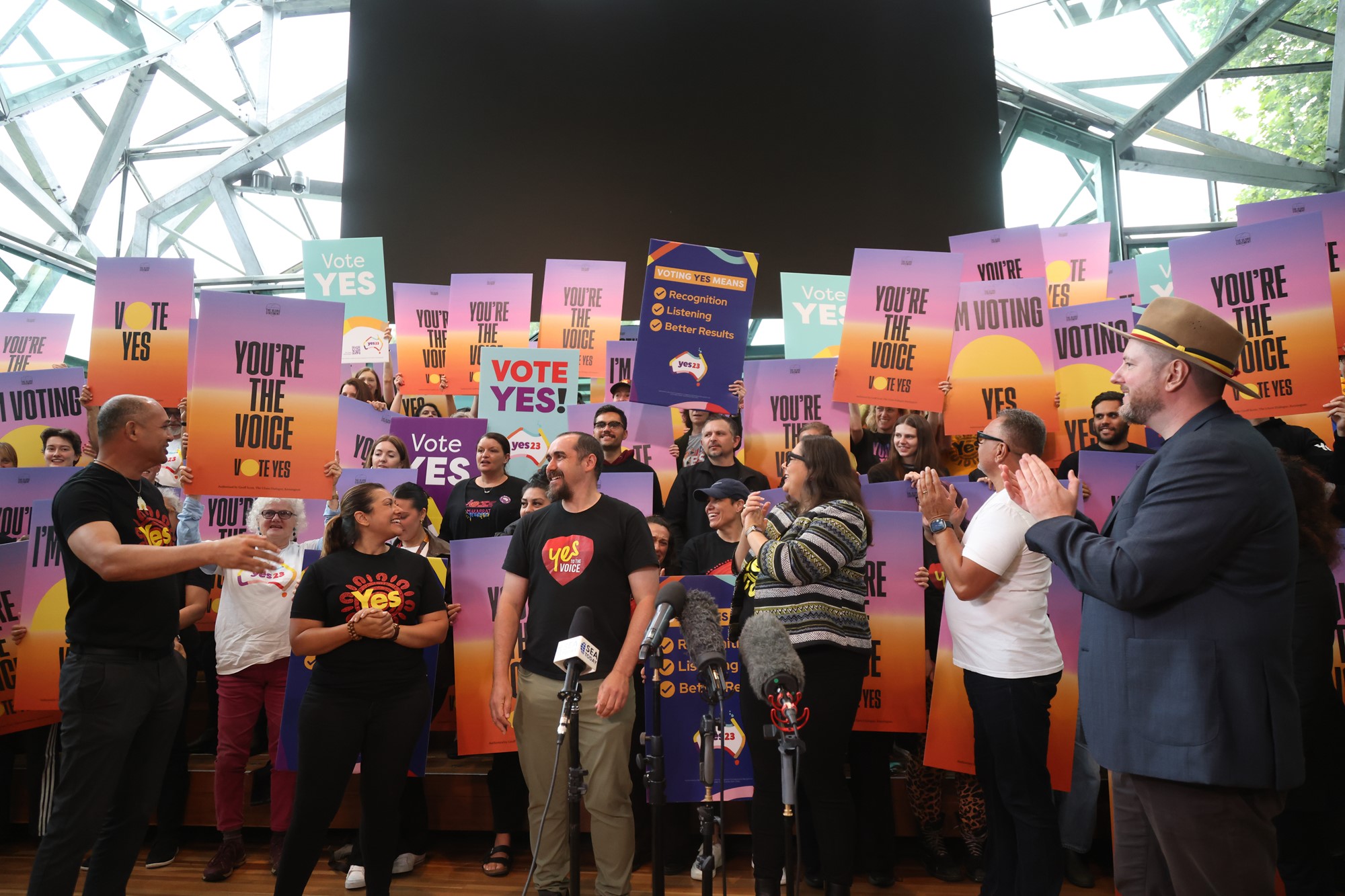 A group of Yes campaigners gather with posters.