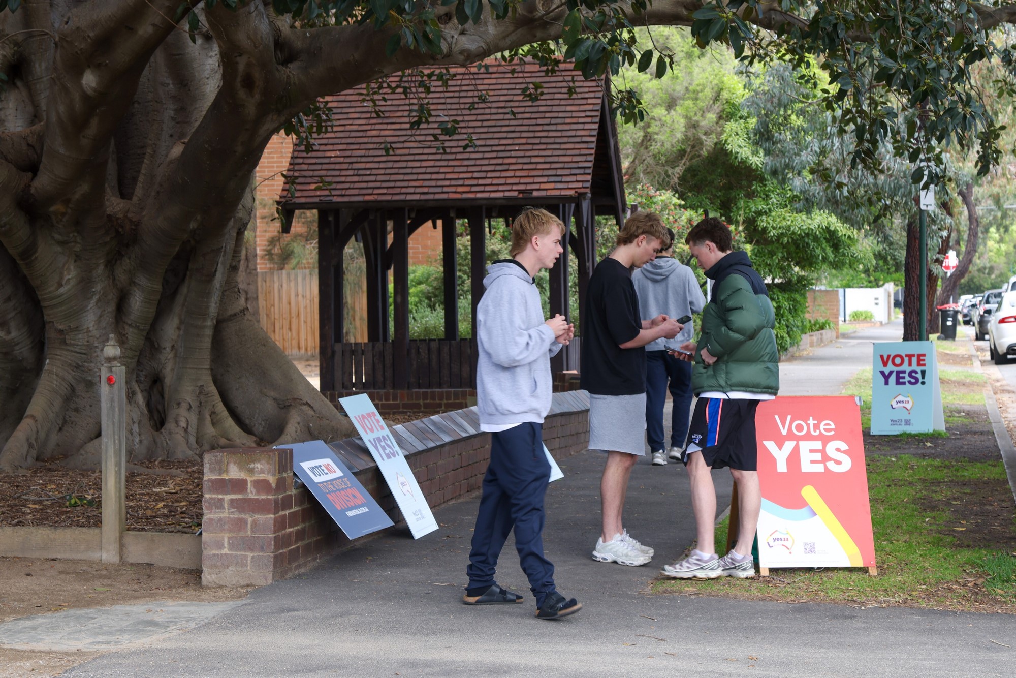 Young men at a polling station.