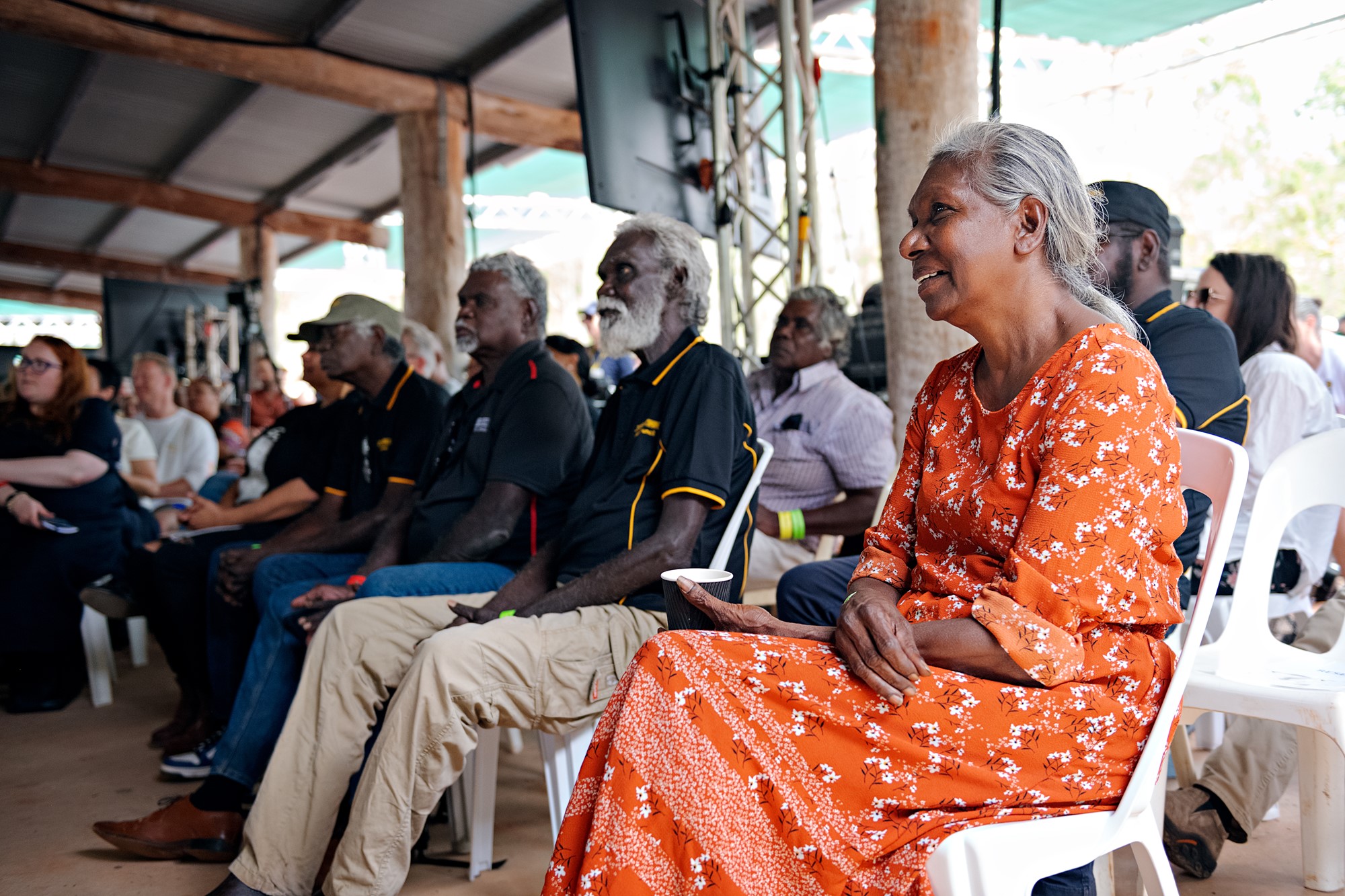 Indigenous elders sitting in the audience and listening to the speech.