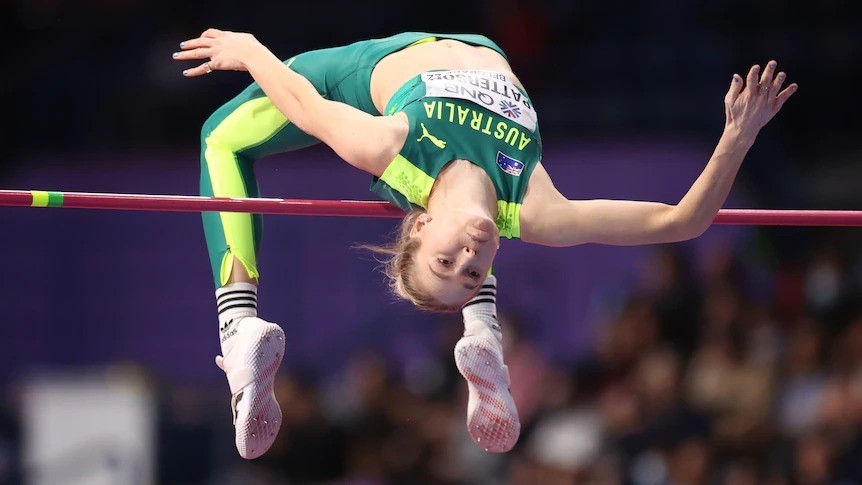 Eleanor Patterson bends her back as she clears the high jump bar.