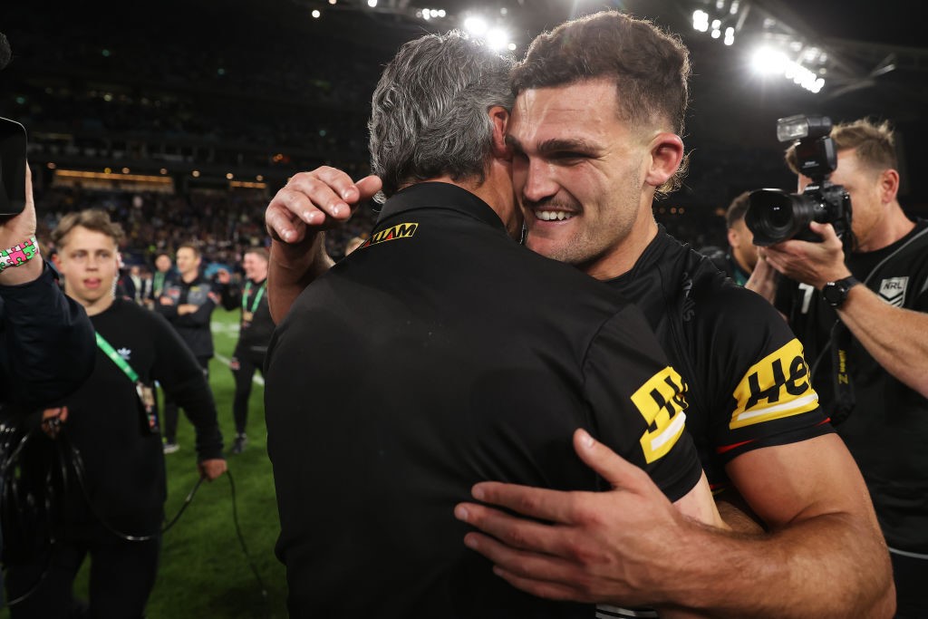 Nathan Cleary hugs father and coach Ivan Cleary after winning the 2022 NRL grand final.