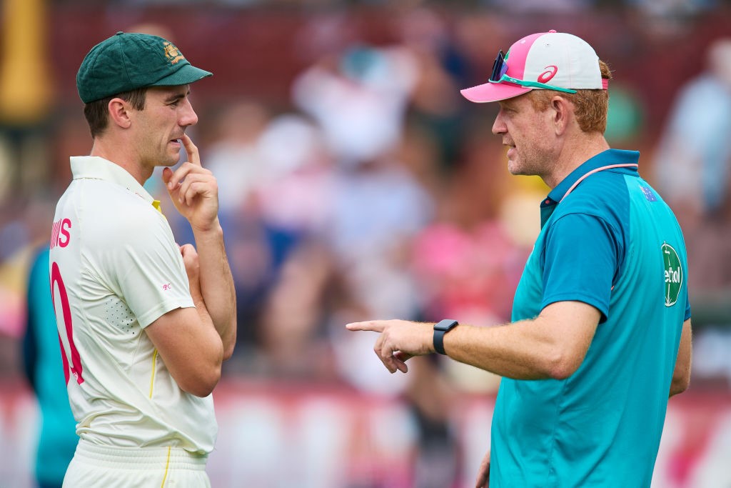 Australia captain Pat Cummins speaks to coach Andrew McDonald during the SCG Test against South Africa.
