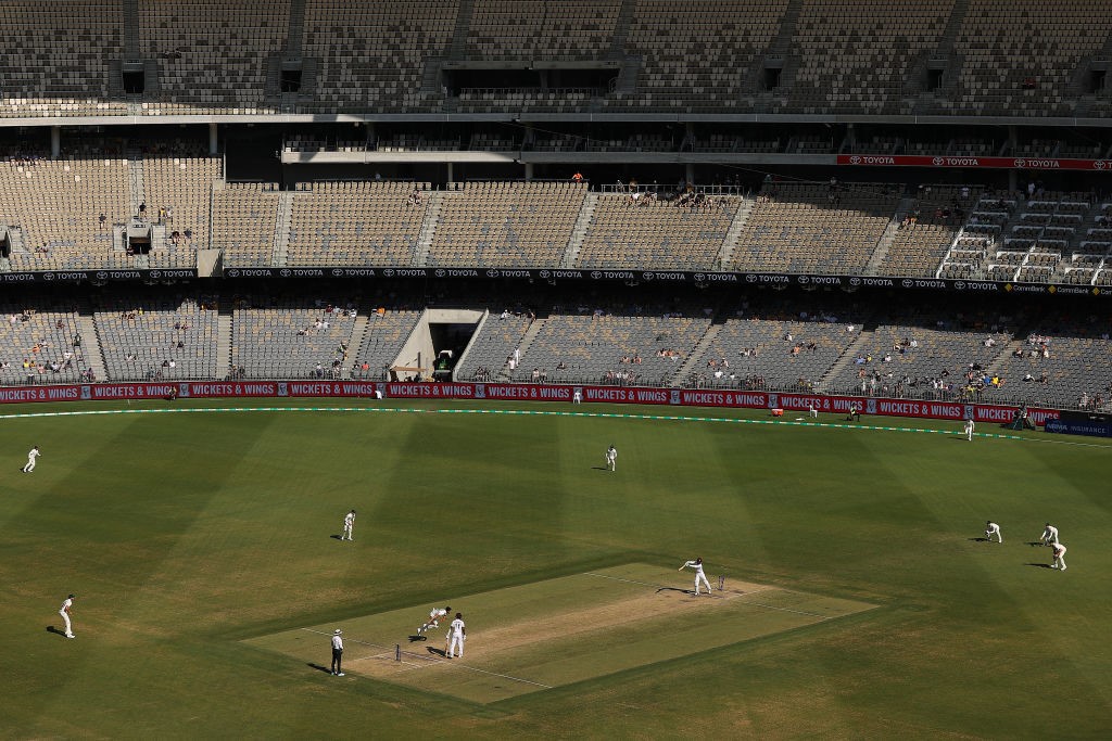 A near-empty Perth Stadium watches a Test cricket match between Australia and West Indies.