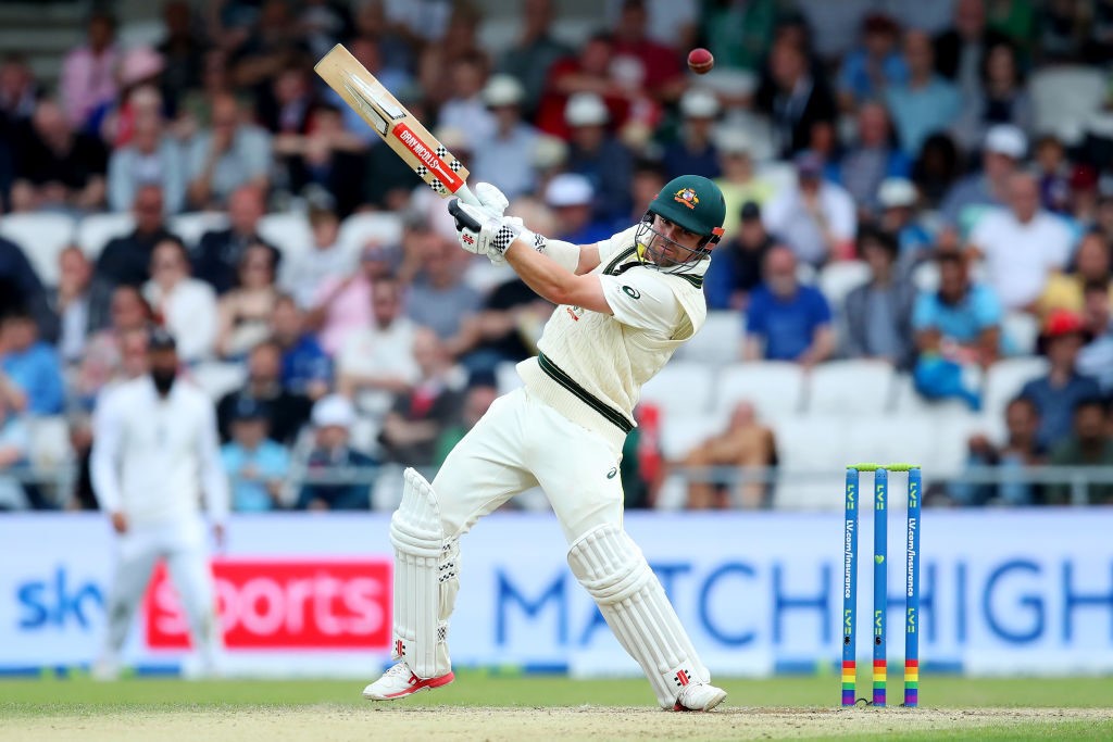 Australia batter Travis Head smashes a ball during an Ashes Test.