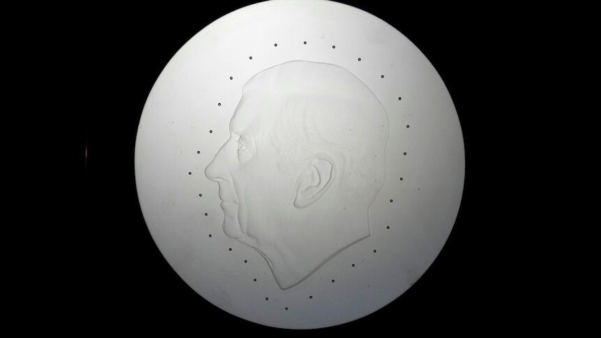 A blank coin for a portrait of King Charles side profile.