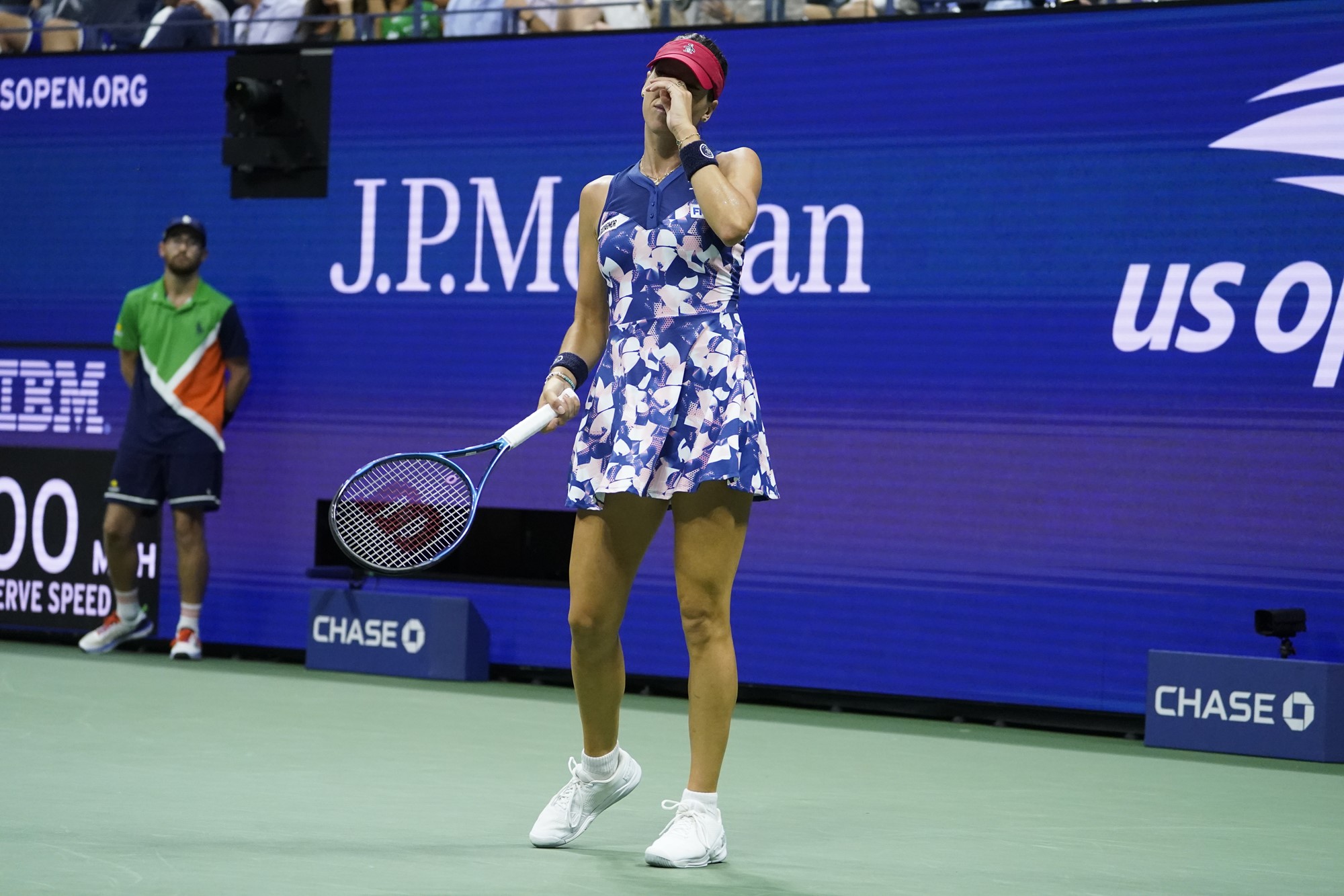 Ajla Tomljanović holds her hand to her face during a US Open match.