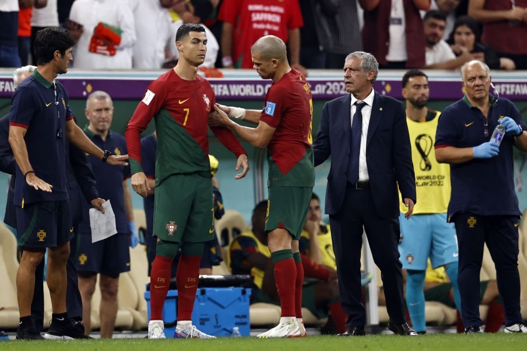 Portugal's Pepe puts the captain's armband onto Cristiano Ronaldo during their Qatar World Cup match against Switzerland.
