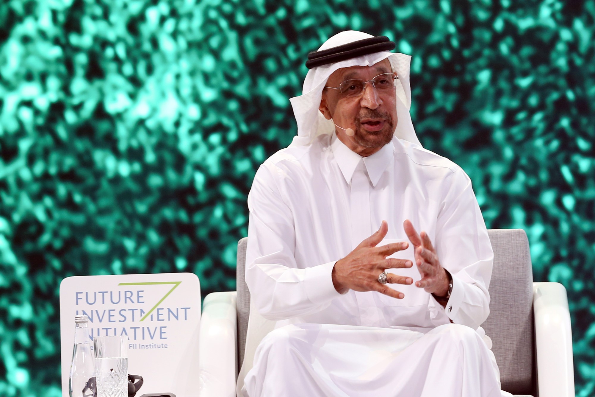 Saudi Arabia's Minister of Investment Khalid Al Falih speaks at an investment event wearing traditional Saudi attire
