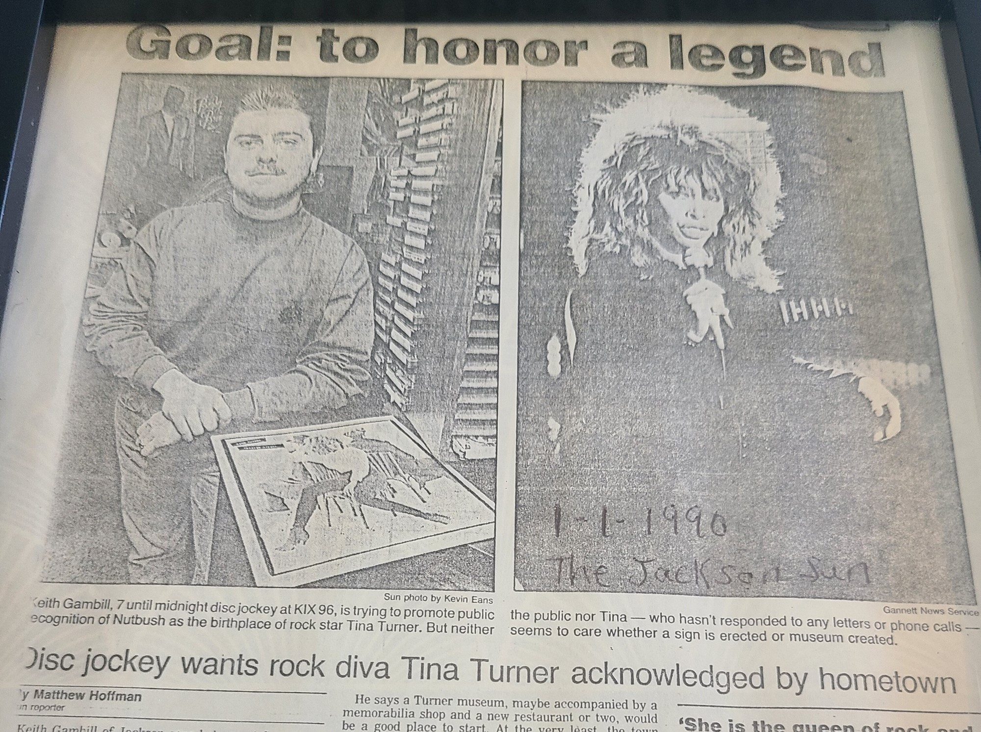 A photo of a newspaper cut out with the headline 'Goal: to honor a legend'.