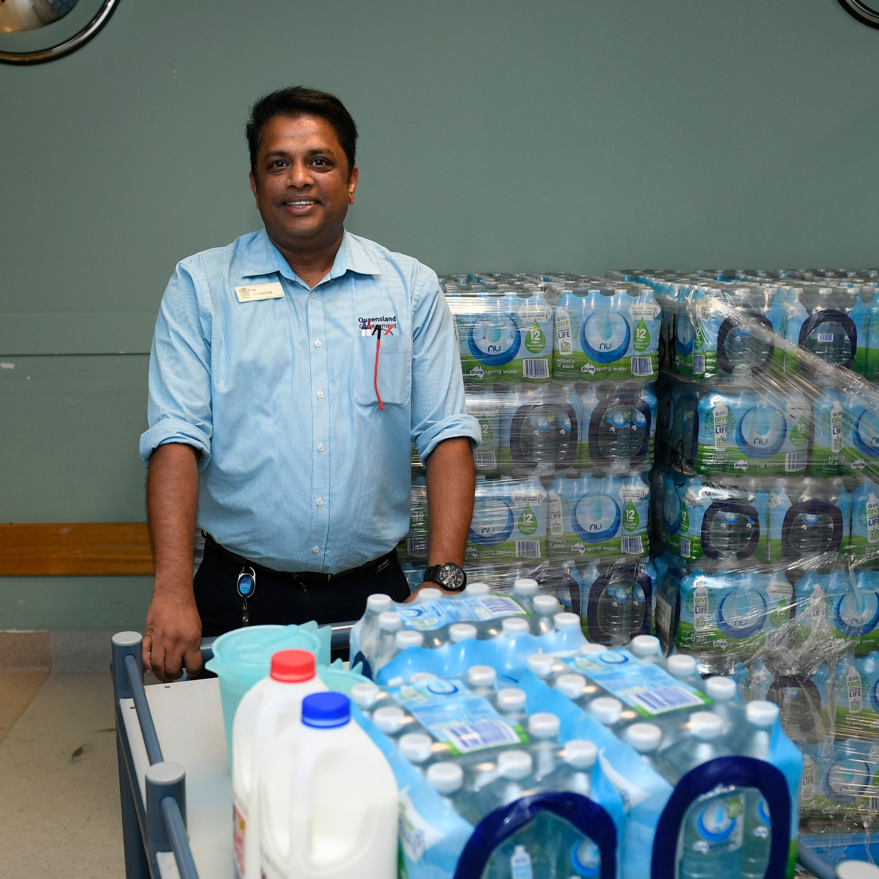 a man with a trolley of water