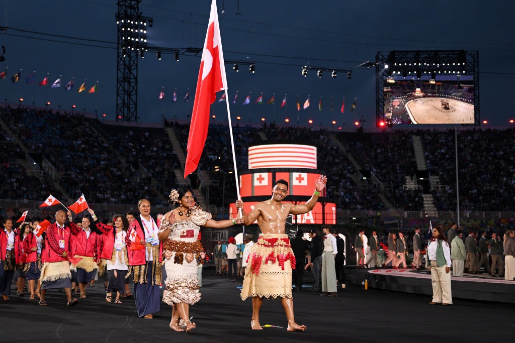flagbearers for tonga at the commonwealth games wearing traditional dre