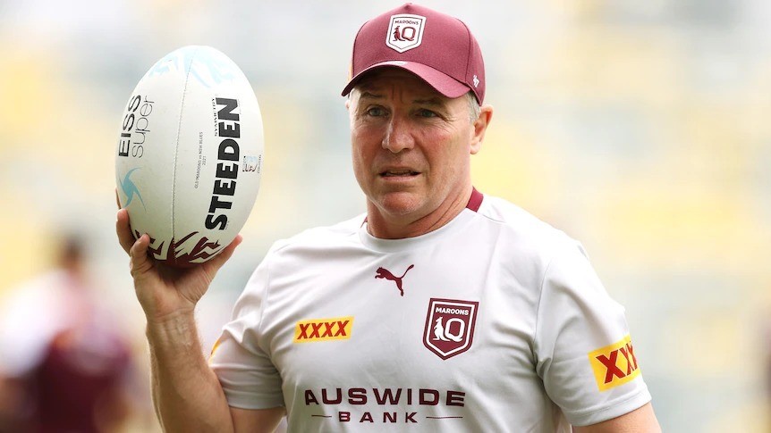 Paul Green holds a rugby league ball while wearing Queensland Maroons training kit.