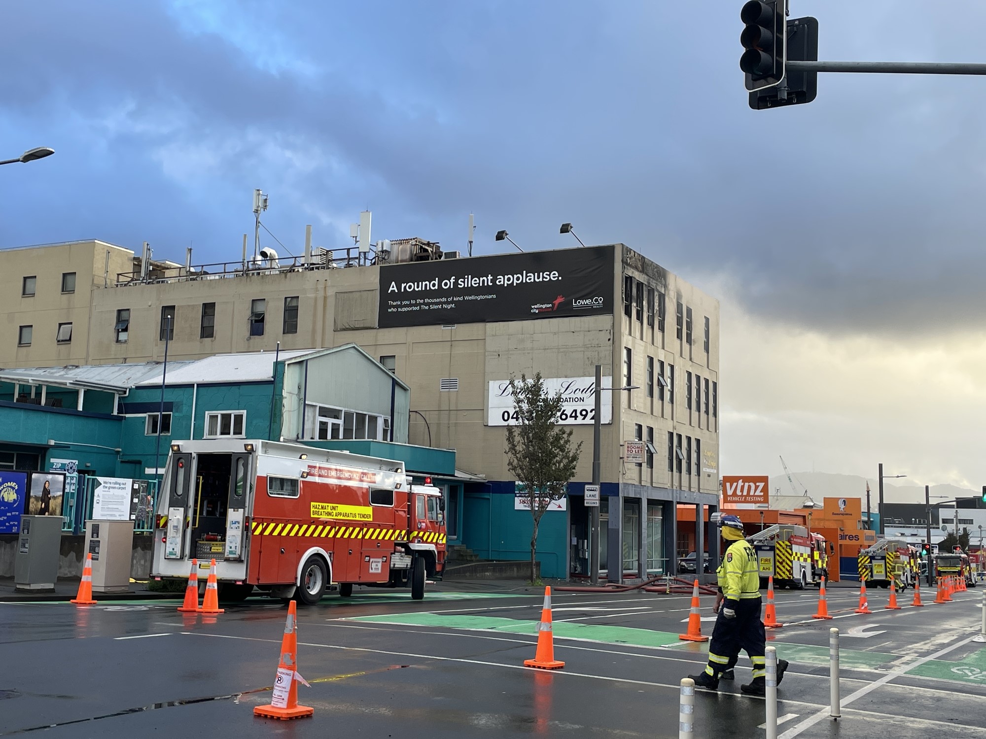 A fire truck outside a building.