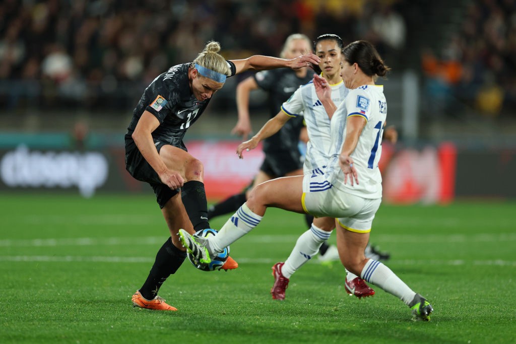 New Zealand's Hannah Wilkinson is pressured by Philippines defenders at the Women's World Cup.