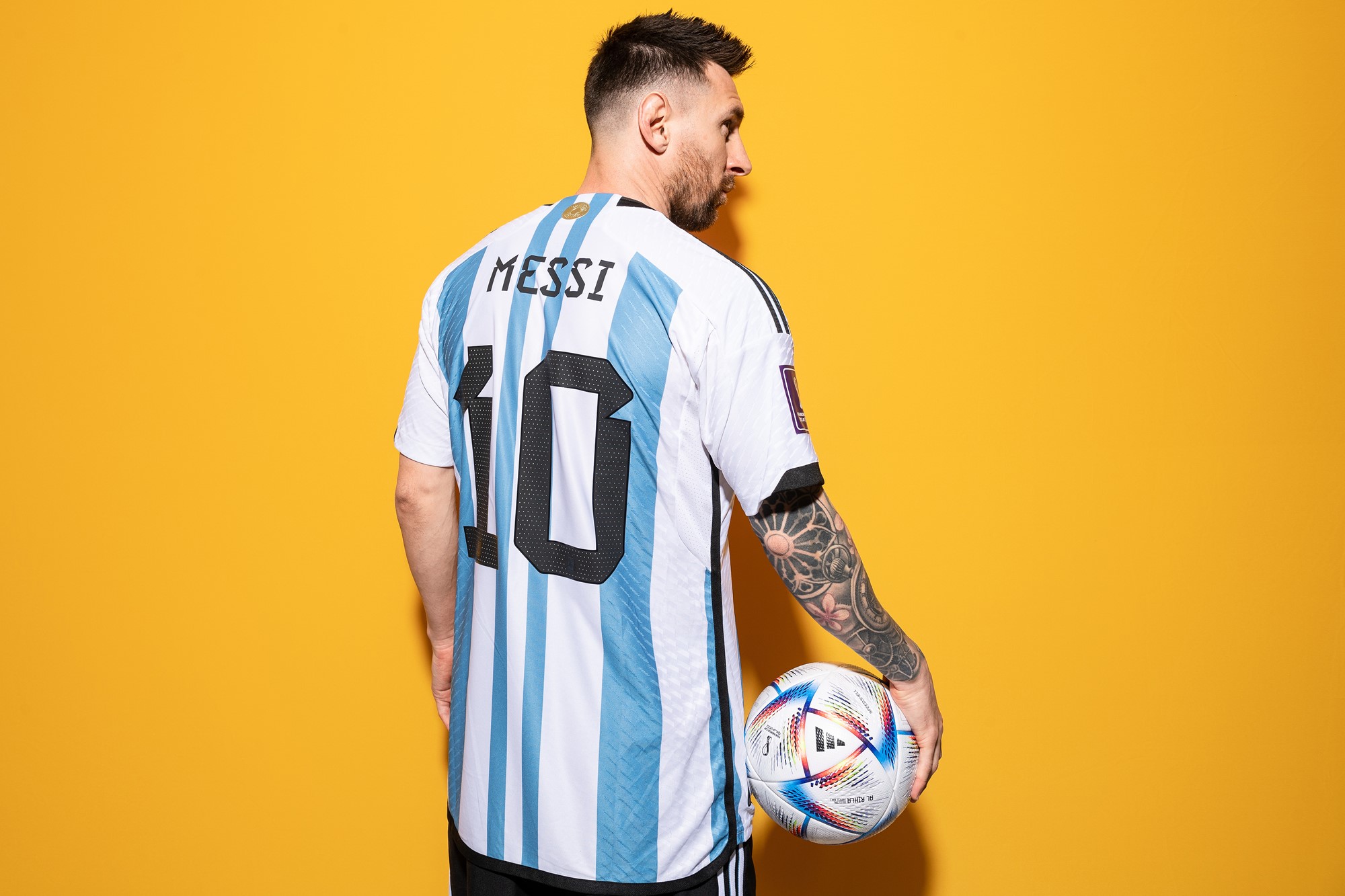 Lionel Messi holding a ball