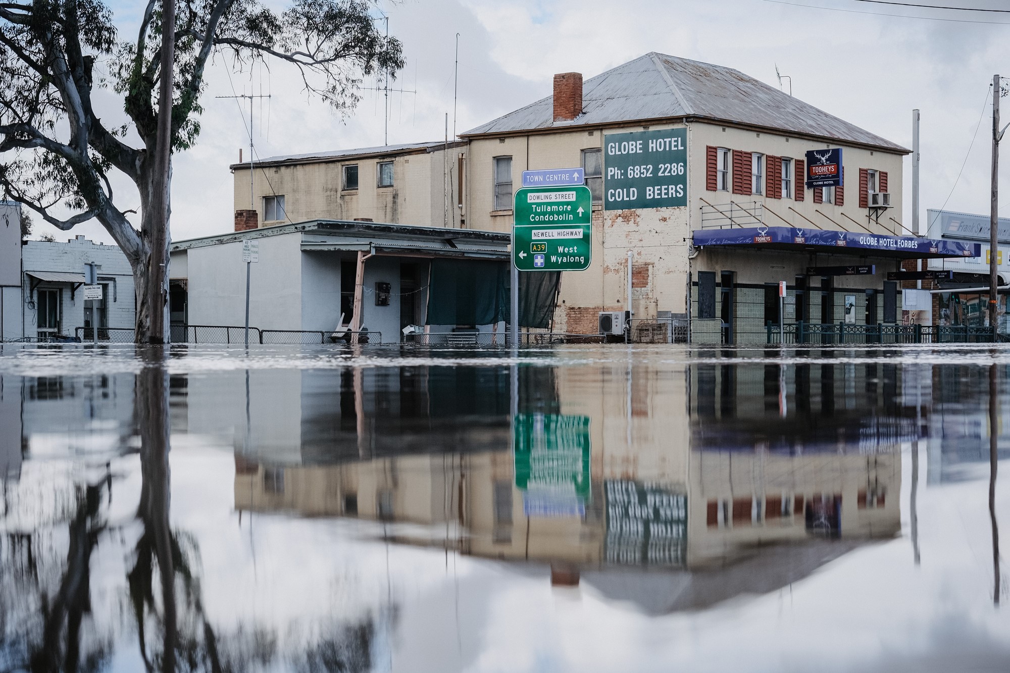 Flood water coveres the streets of the town near the Globe Hotel