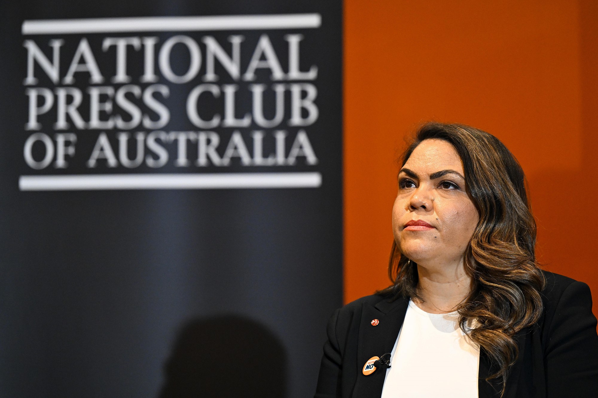 Jacinta Price next to a sign which says National Press Club of Australia