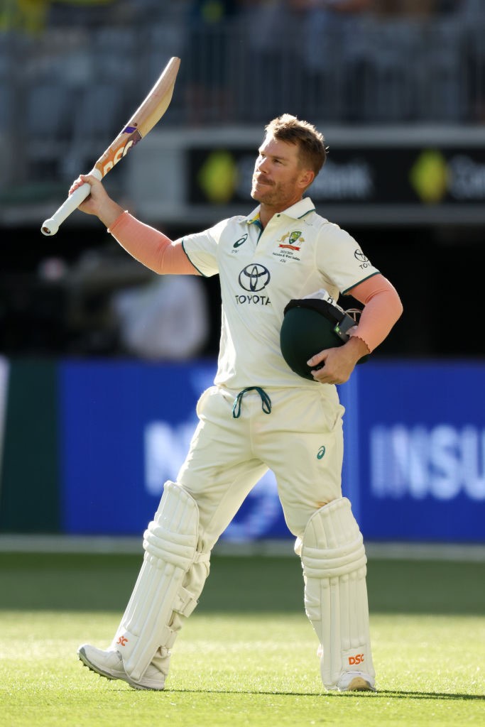 David Warner raises his bat as he leaves the field of play during a Test against Pakistan.