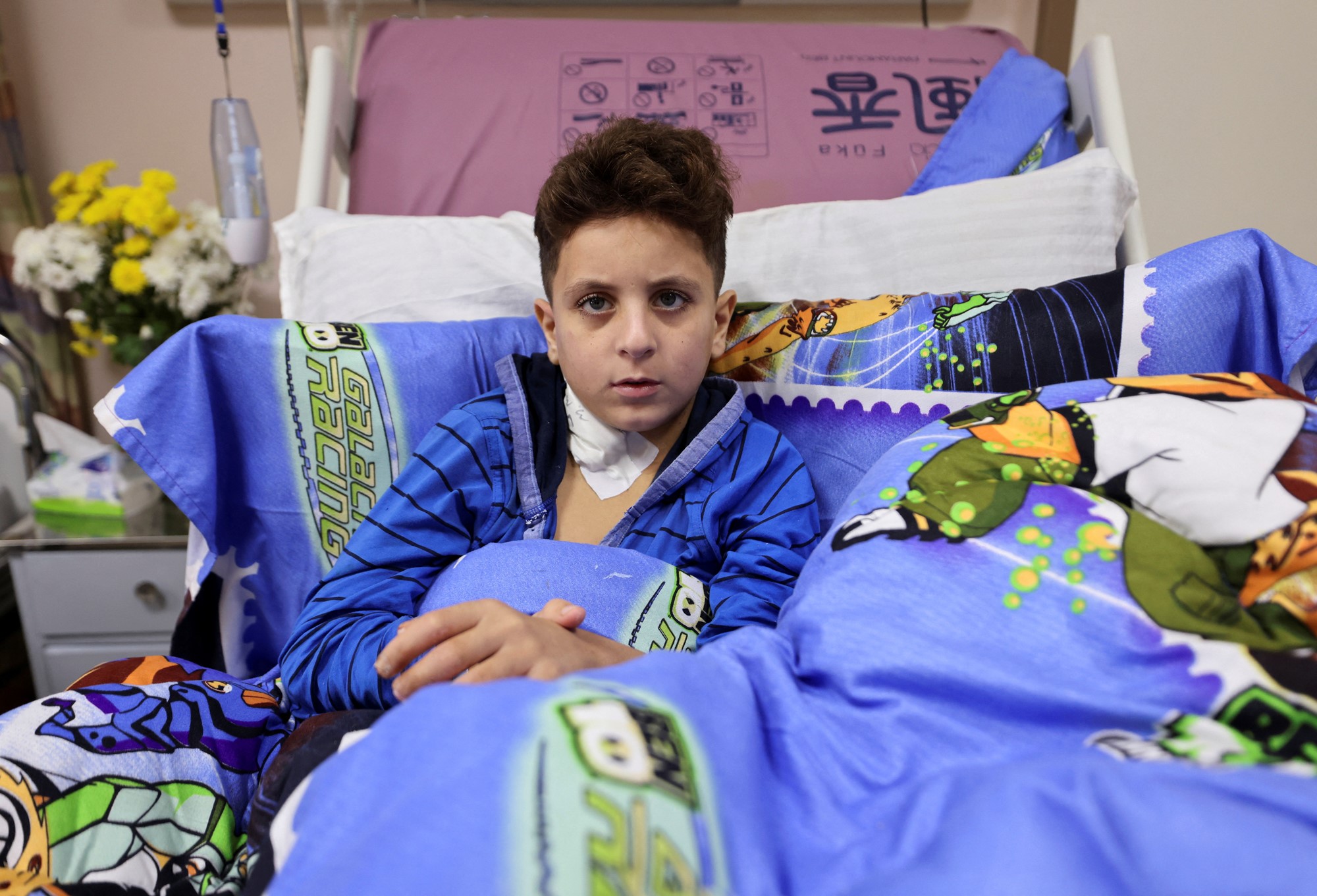 A boy in a hospital bed.
