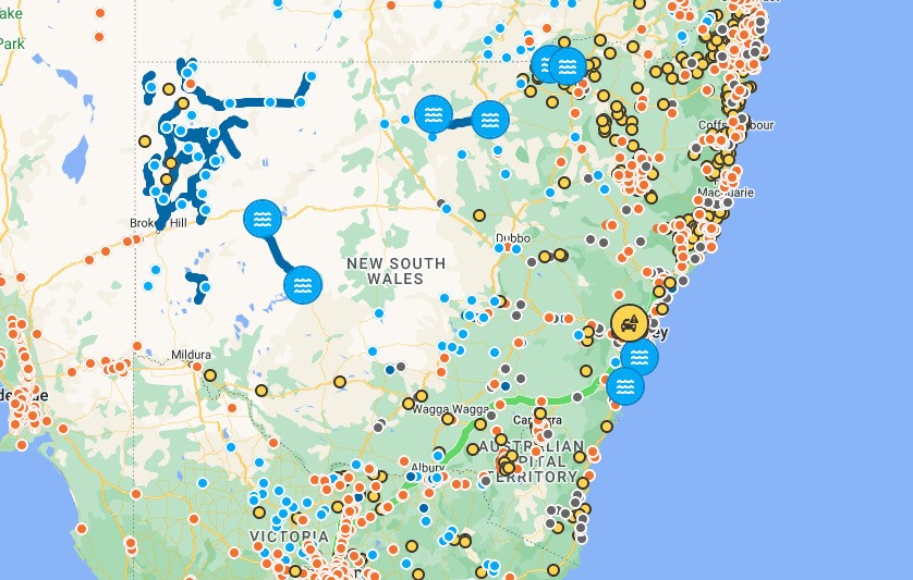 A map shows dots where roads are flooded or being fixed