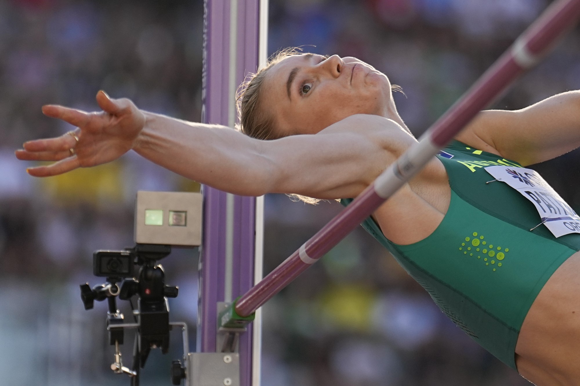 Eleanor Patterson puts her arm over the bar during the high jump final at the athletics world championships.