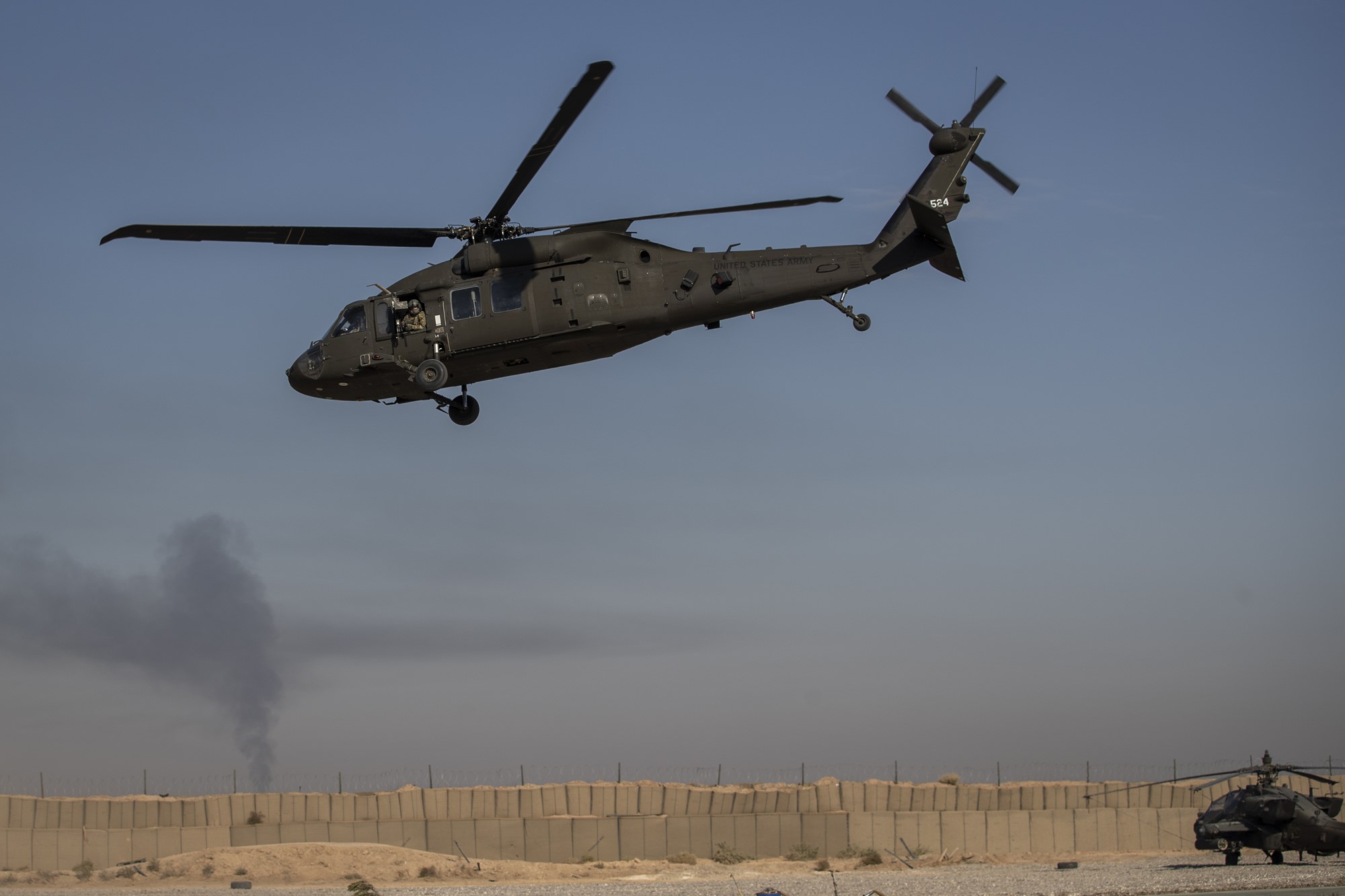 A helicopter takes off from a US military base.