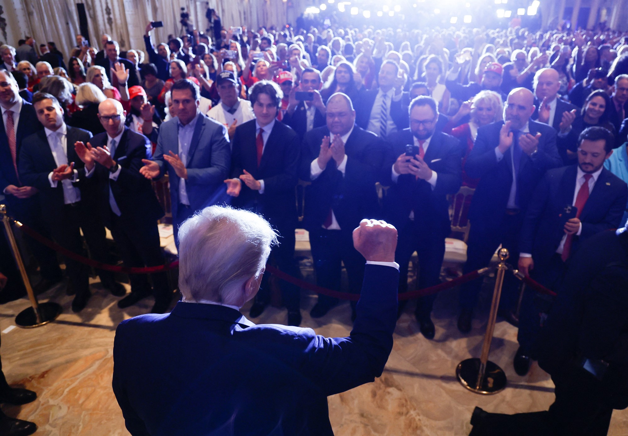 Trump thrusts his fist in the air in front of a crowd of supporters after his speech.