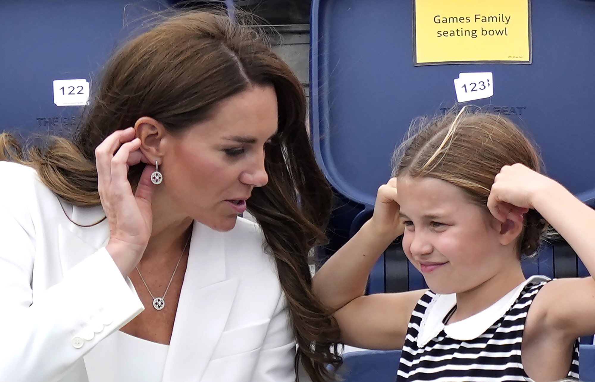 duchess kate speaks to daughter charlotte sitting in grandstand at swimming arena