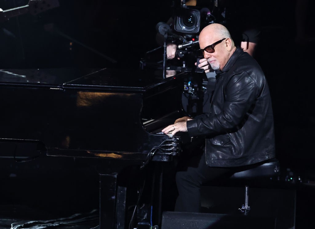 Billy Joel at a piano