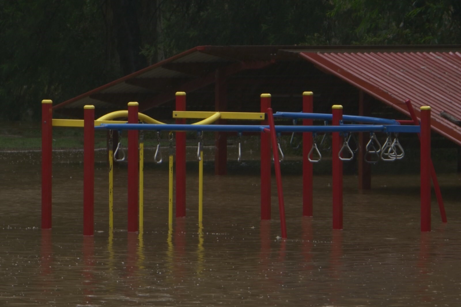 Picture shows water rising around monkeybars.