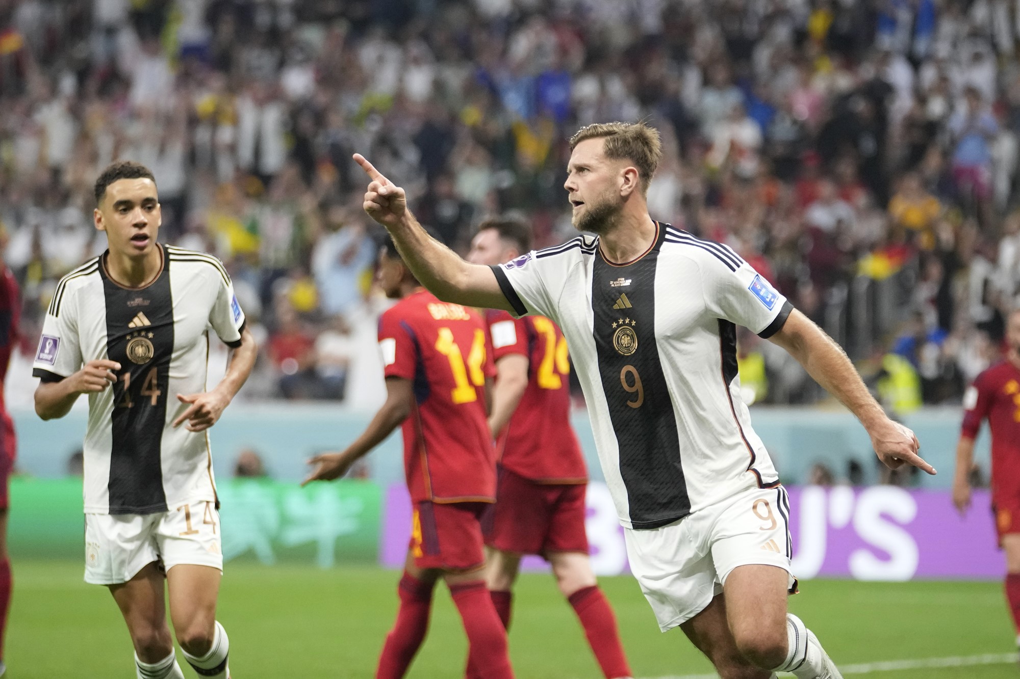 Germany's Niclas Füllkrug celebrates a goal against Spain at the World Cup.