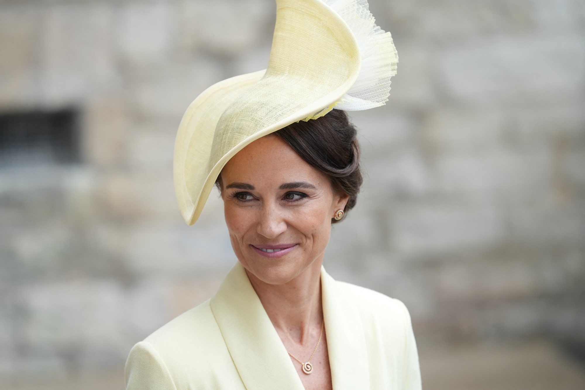 Pippa smiles in yellow.