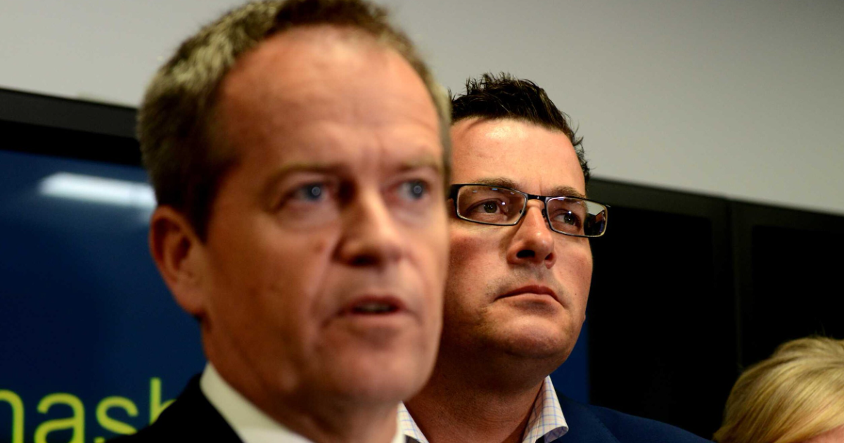 Bill Shorten stands with Daniel Andrews.