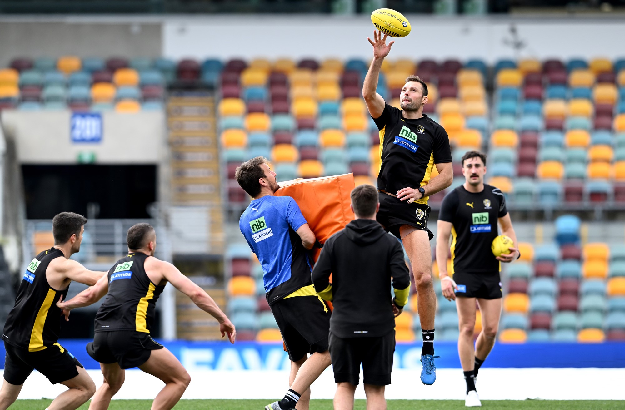 Toby Nankervis taps the ball during a ruck drill on the Gabba